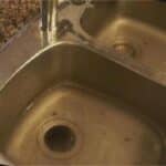 Dirty stainless steel double sink.
